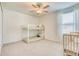 Bedroom with a ceiling fan, neutral walls and carpet flooring at 111 Rain Lily Ave, Spring Hill, FL 34609