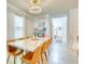 Elegant dining area featuring a marble table and a modern chandelier at 111 Rain Lily Ave, Spring Hill, FL 34609
