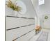 Inviting entryway with shoe rack, bench, and a decorative mirror and wreath at 111 Rain Lily Ave, Spring Hill, FL 34609