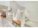 Bright entryway featuring stairs, modern storage solutions, bench, and light-filled space at 111 Rain Lily Ave, Spring Hill, FL 34609