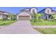 Charming two-story home with well-maintained lawn, neutral paint, and a two-car garage at 111 Rain Lily Ave, Spring Hill, FL 34609