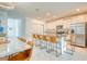 Open kitchen with stainless steel appliances, granite countertops, and counter seating at 111 Rain Lily Ave, Spring Hill, FL 34609