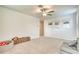 Spacious living room with carpet and neutral-toned walls with lots of natural light at 111 Rain Lily Ave, Spring Hill, FL 34609