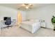 Serene bedroom featuring a comfortable bed, a work desk, and an ensuite bathroom at 111 Rain Lily Ave, Spring Hill, FL 34609