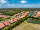 Gorgeous aerial view of single-Gathering homes with serene ponds and lush greenery in a Primary-planned community at 11666 Parrotfish St, Venice, FL 34292