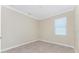 This bedroom is empty with tile flooring and a window with window blinds for the natural light at 11666 Parrotfish St, Venice, FL 34292