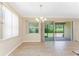 Bright dining area with sliding glass doors leading to the outdoor patio at 11666 Parrotfish St, Venice, FL 34292