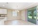 Cozy dining area with sliding doors, adjacent to the kitchen at 11666 Parrotfish St, Venice, FL 34292