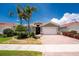 Beautiful one-story home with a brick driveway, two-car garage, well-maintained lawn and Florida landscaping at 11666 Parrotfish St, Venice, FL 34292
