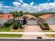 Charming one-story home featuring a brick driveway, attached two-car garage and lush landscaping at 11666 Parrotfish St, Venice, FL 34292