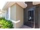 Close-up view of the front entry with a decorative security door and beige exterior at 11666 Parrotfish St, Venice, FL 34292