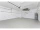 Large garage with epoxy flooring, shelving and water heater at 11666 Parrotfish St, Venice, FL 34292