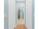 Hallway with closet and shower doors leading to other rooms at 11666 Parrotfish St, Venice, FL 34292