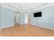 The main bedroom has blue walls and tray ceilings with an adjacent entryway at 11666 Parrotfish St, Venice, FL 34292