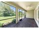 Covered brick patio overlooking the spacious, well-manicured backyard at 11666 Parrotfish St, Venice, FL 34292