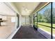 Covered brick patio connecting to the kitchen and overlooking the spacious backyard at 11666 Parrotfish St, Venice, FL 34292