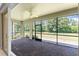 Covered brick patio overlooking the spacious, well-manicured backyard at 11666 Parrotfish St, Venice, FL 34292