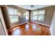Sunlit bedroom with wood floors and multiple windows at 1250 Lemon St, Punta Gorda, FL 33950