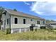 Quaint home with horizontal siding, an elevated wood deck, and a lawn at 1250 Lemon St, Punta Gorda, FL 33950