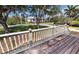 Inviting front porch with wooden railings and a view of the surrounding neighborhood at 1250 Lemon St, Punta Gorda, FL 33950
