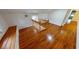 Hallway boasting hardwood floors, wood banister, and natural light, inviting passage to other areas at 1250 Lemon St, Punta Gorda, FL 33950