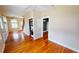 Spacious living room with wood floors, ceiling fan, and washer/dryer at 1250 Lemon St, Punta Gorda, FL 33950