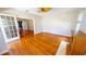 Spacious living room featuring polished hardwood floors, a ceiling fan, and fireplace at 1250 Lemon St, Punta Gorda, FL 33950