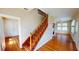 Traditional staircase with wood railing leading to upper level at 1250 Lemon St, Punta Gorda, FL 33950