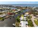 Aerial view of a waterfront home with a metal roof, surrounding canals, and scenic water views at 155 Donna Ct, Punta Gorda, FL 33950