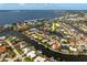 Overhead view of waterfront homes nestled among canals and a vast bay in the background at 155 Donna Ct, Punta Gorda, FL 33950