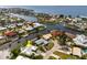 Expansive aerial view of the waterfront neighborhood with canals and distant bay views at 155 Donna Ct, Punta Gorda, FL 33950