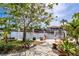 Beautiful backyard with waterfront views, a dock, and lush landscaping at 155 Donna Ct, Punta Gorda, FL 33950