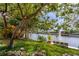 Picturesque backyard featuring lush greenery and tranquil waterfront views at 155 Donna Ct, Punta Gorda, FL 33950