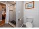 Bathroom featuring tiled walk-in shower, shiplap walls, and modern fixtures at 155 Donna Ct, Punta Gorda, FL 33950