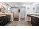 Bathroom featuring granite countertop, modern lighting, and a walk-in shower with stone-tiled floor at 155 Donna Ct, Punta Gorda, FL 33950