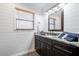Bathroom showcasing granite countertop, dark cabinetry, and shiplap walls at 155 Donna Ct, Punta Gorda, FL 33950