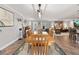 Open concept dining area with wood table and chairs, seamlessly connected to living area with natural light at 155 Donna Ct, Punta Gorda, FL 33950