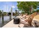 Waterfront property showcasing a private dock with seating area, perfect for enjoying peaceful moments by the water at 155 Donna Ct, Punta Gorda, FL 33950