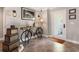 Home foyer featuring tile floors and decorative touches including a vintage bicycle table at 155 Donna Ct, Punta Gorda, FL 33950