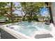 Inviting hot tub offers a relaxing space with scenic waterfront views at 155 Donna Ct, Punta Gorda, FL 33950