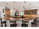 Spacious kitchen features granite countertops, custom cabinets, stainless steel appliances, and island with bar seating at 155 Donna Ct, Punta Gorda, FL 33950