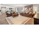 Comfortable living room with two sofas, area rug, and unique wooden world map art piece at 155 Donna Ct, Punta Gorda, FL 33950