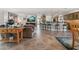 Open-concept living room featuring tile floors, a large kitchen island, and seamless flow for entertaining at 155 Donna Ct, Punta Gorda, FL 33950