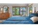 Bright main bedroom overlooking lush backyard, complemented by a wooden dresser and hardwood flooring at 155 Donna Ct, Punta Gorda, FL 33950
