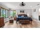 Comfortable main bedroom with hardwood flooring, a fan, and ample natural light at 155 Donna Ct, Punta Gorda, FL 33950
