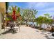 Outdoor patio with a seating area and serene waterfront views and landscaping at 155 Donna Ct, Punta Gorda, FL 33950