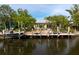 Waterfront home featuring a private dock, seating, and clear water views at 155 Donna Ct, Punta Gorda, FL 33950