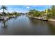 Scenic canal view highlighting the property with private dock, perfect for boating enthusiasts and relaxation at 155 Donna Ct, Punta Gorda, FL 33950