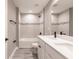 Modern bathroom featuring a tiled shower-tub, white cabinets, and a sleek quartz countertop with double sinks at 16280 Minorca Dr, Punta Gorda, FL 33955