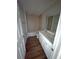Bathroom with double sinks, wood floor and a bathtub at 16280 Minorca Dr, Punta Gorda, FL 33955